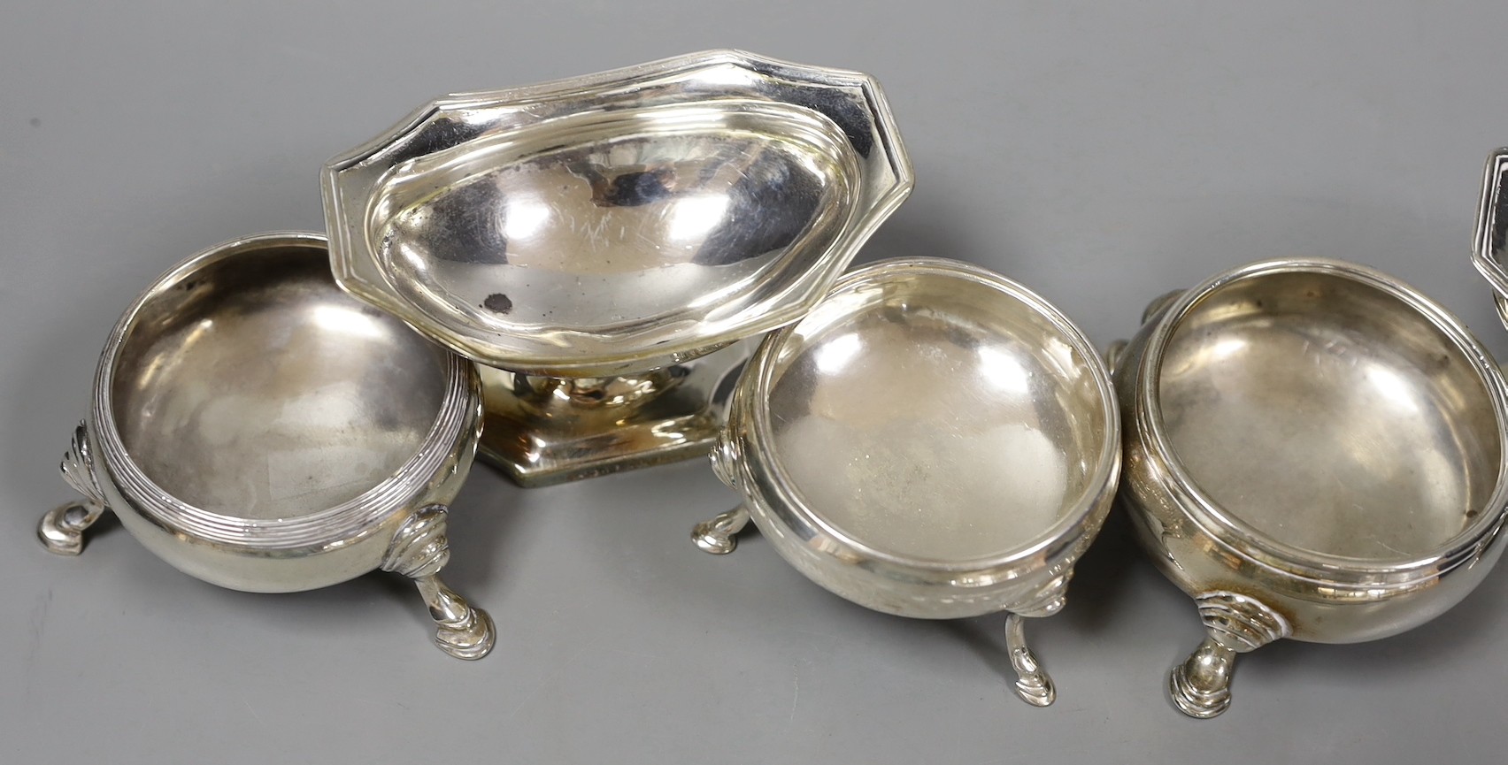 A pair of George III silver boat shaped pedestal salts, Abstinando King, London, 1800, 92mm and four other assorted silver salts.